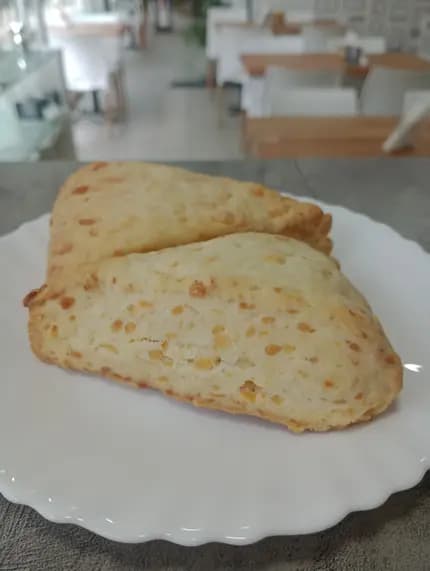 Scons de queso por unidad